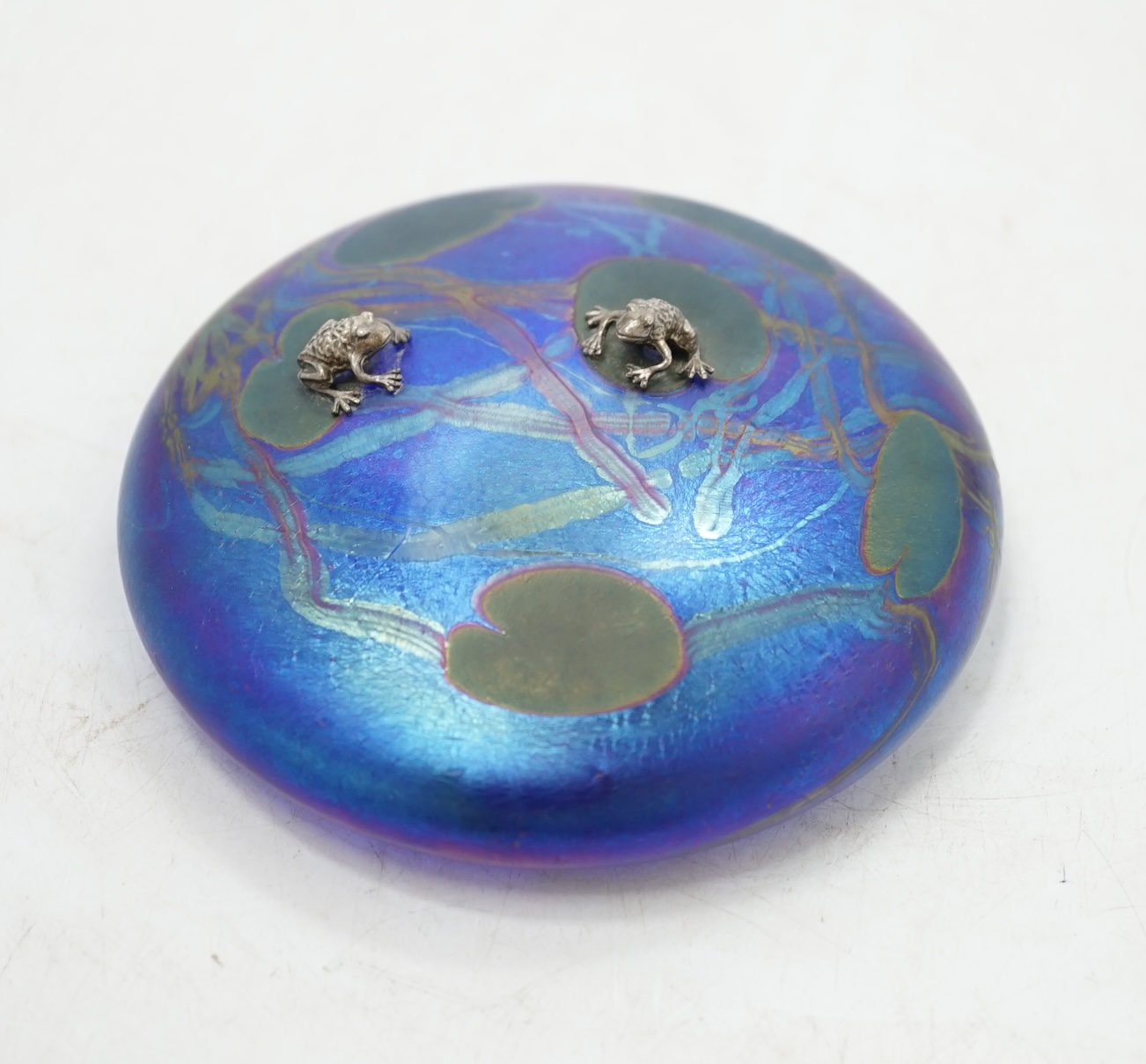 A John Ditchfield for Glasform disc shaped paperweight with mounted metal frogs on a lily pad, 10cm diameter. Condition - good